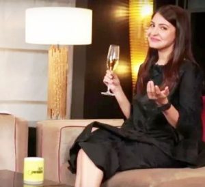Anushka Sharma posing with a glass of alcohol