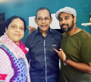 Bosco Martis with his parents