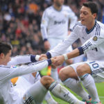 Mesut Ozil with Cristiano Ronaldo