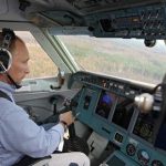 Vladimir Putin co-piloting a plane