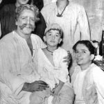 The Kapoor Family - Raj Kapoor and Shammi Kapoor (standing); Prithviraj Kapoor with Randhir Kapoor on his lap and Shashi Kapoor (sitting)