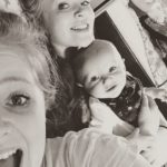 Pippa Hughes with her baby brother and elder sister