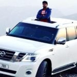 Aakash Kumar Sehdev poses with his car Nissan Pathfinder