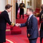James Corden receiving OBE at Buckingham Palace, London