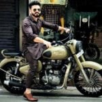 Basheer Bashi poses with his bike Royal Enfield