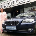Pearle Maaney poses with her car BMW 520i