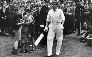 Don Bradman walks out to bat