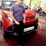 Rahulram Manchanda poses with his Mahindra KUV 100 car