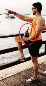 Shivashish Mishra with a beer bottle in his hand