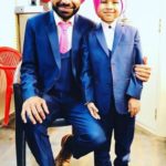 Harby Sangha with his son