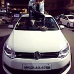 Danish Zehen poses with his Volkswagen car