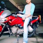 Lavin Gothi poses with his TVS Apache RTR bike