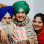 Amar Sehmbi with his parents