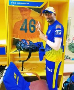 Harishankar Reddy posing before his wardrobe inside CSK's dressing room