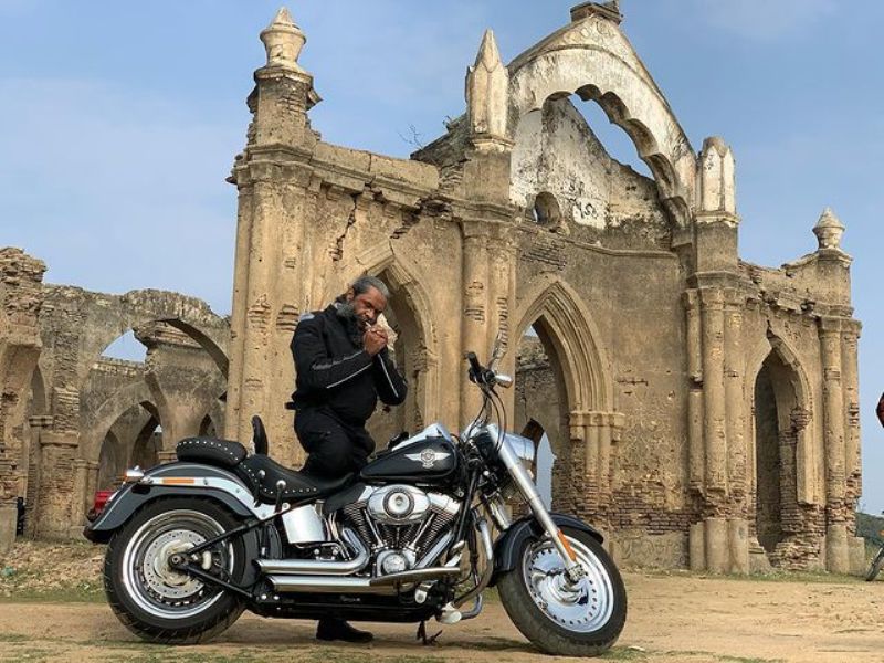 Avinash poses with his Harley Davidson