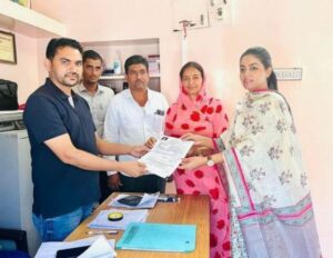 Divya Maderna posing after being elected as the President of Gram Seva Sahakari Samiti Limited of Chadi village in Jodhpur