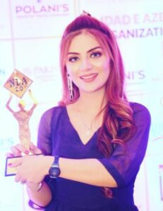 Rida Isfahani posing with her Emerging Film Star Award at the Nation Leader Awards 2022